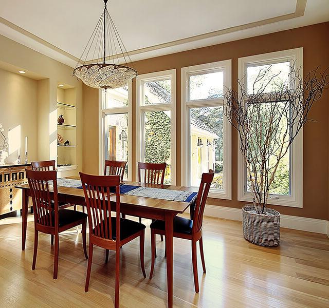 Four replacement casement windows in a dining room